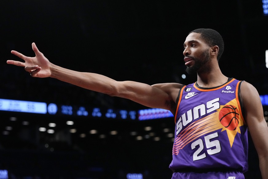 Phoenix Suns forward Mikal Bridges reacts after scoring a three-point basket during the second half of an NBA basketball game against the Brooklyn Nets, Tuesday, Feb. 7, 2023, in New York. The Suns wo ...