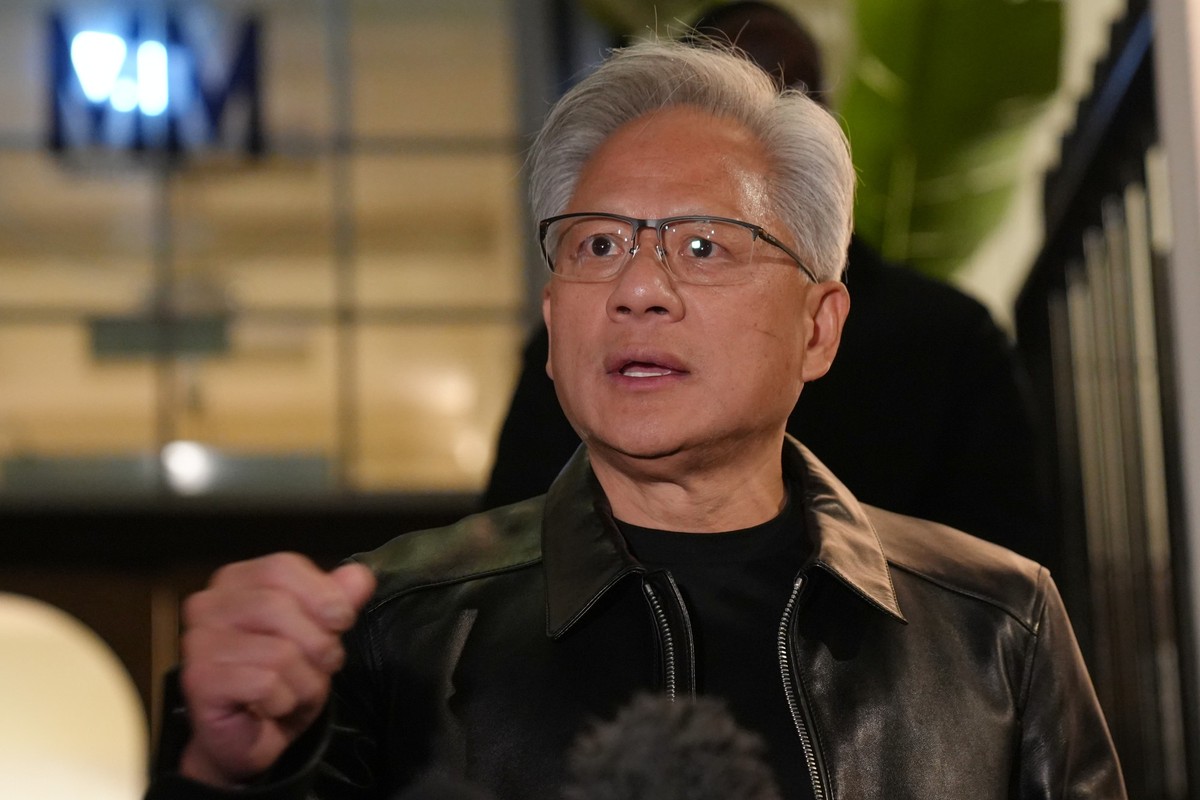 Nvidia CEO Jensen Huang speaks to the media and attendees after a reception celebrating the UK's technology ecosystem and AI advances in London, Wednesday, Oct. 14, 2026. (AP Photo/Kwiyeon Ha)