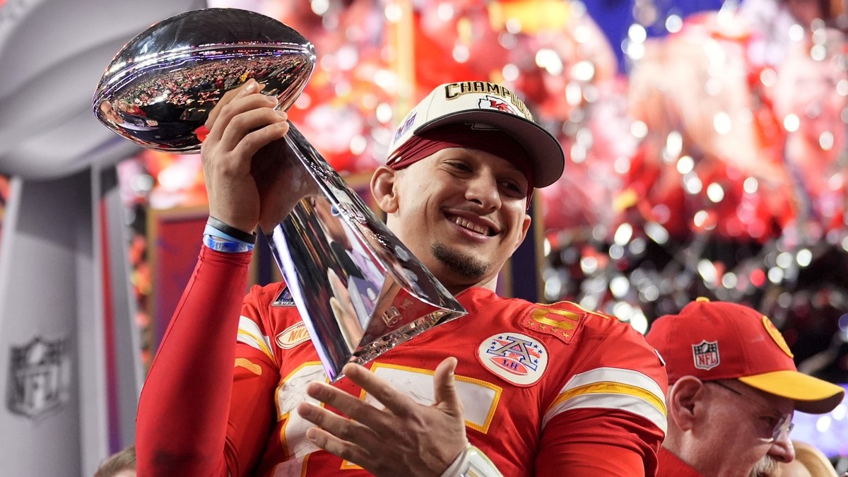 FILE - Kansas City Chiefs quarterback Patrick Mahomes celebrates with the trophy after the team's win in overtime during the NFL Super Bowl 58 football game against the San Francisco 49ers, Sunda ...