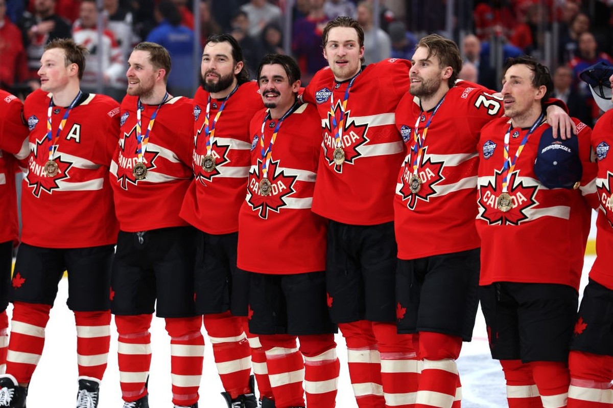 BOSTON, MASSACHUSETTS - FEBRUARY 20: (L-R) Cale Makar #8, Devon Toews #5, Drew Doughty #89, Seth Jarvis #24, Travis Sanheim #6, Brandon Hagel #38 and Brad Marchand #63 of Team Canada stand together at ...