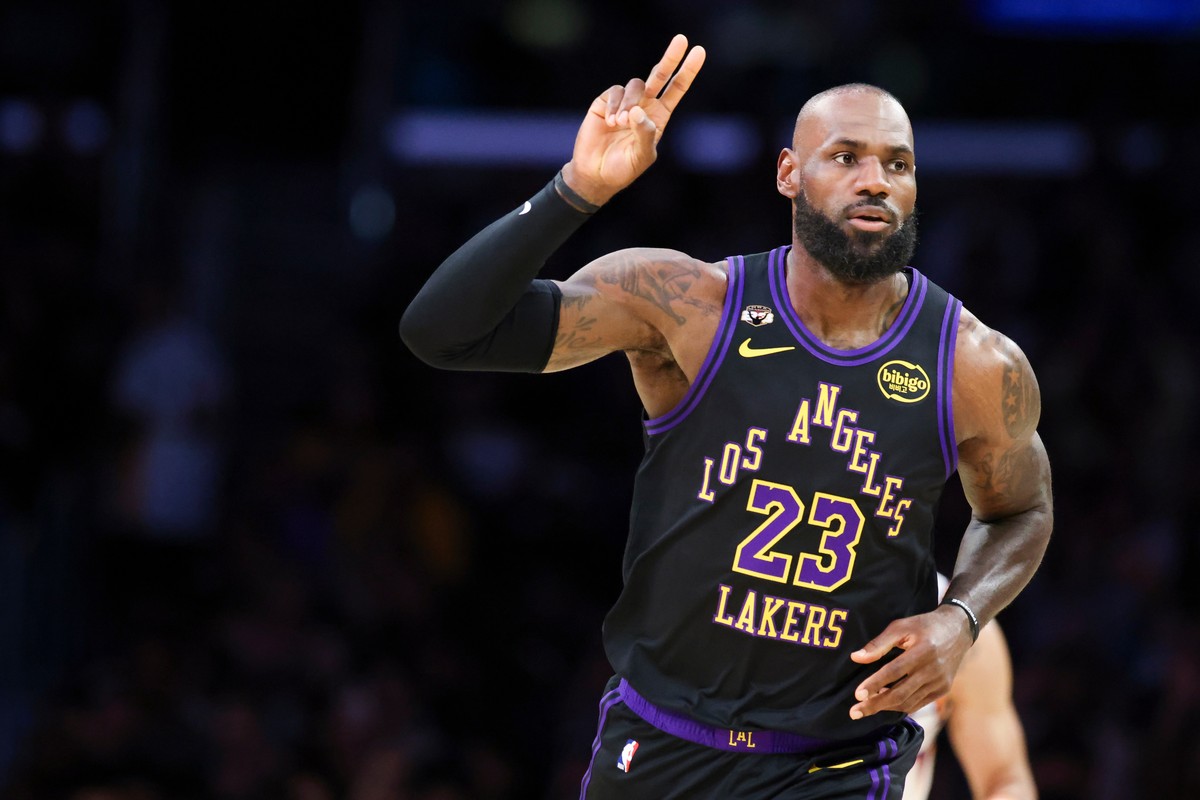 Los Angeles Lakers forward LeBron James gestures after making a basket against the Phoenix Suns during the first half of an NBA basketball game, Friday, April 10, 2026, in Los Angeles. (AP Photo/Jessi ...