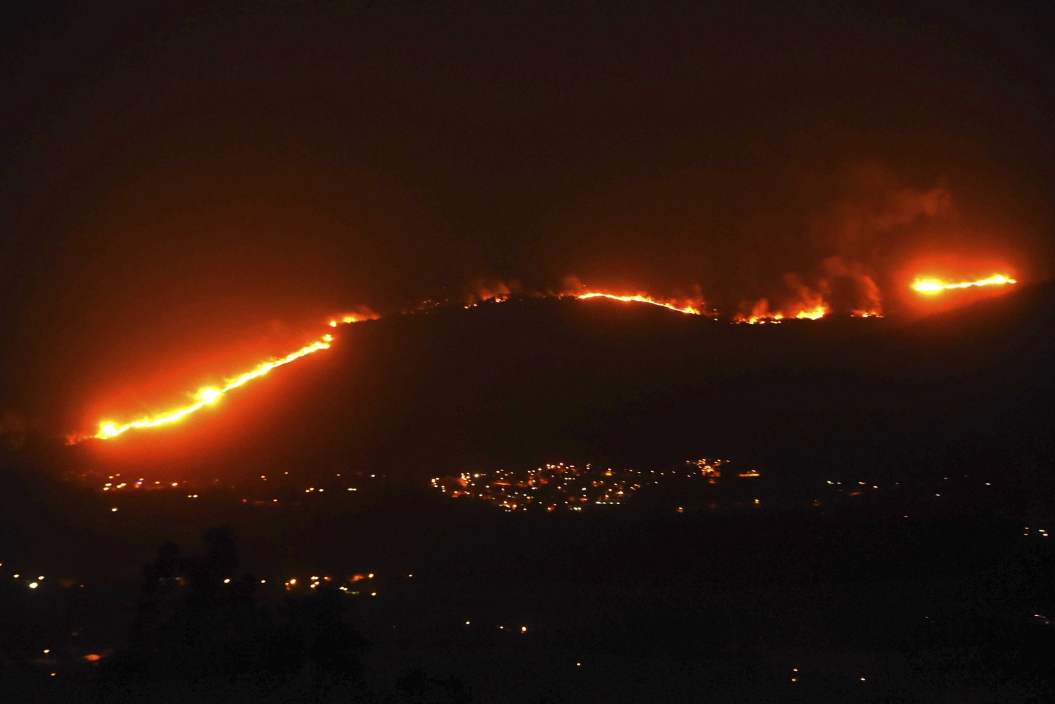 A wild fire burnt a forrest near Gondomar, Pontevedra, in the northwestern Spanish region of Galicia, Spain on Monday, Oct. 16, 2017. Authorities in Portugal and Spain say that nine people died over t ...