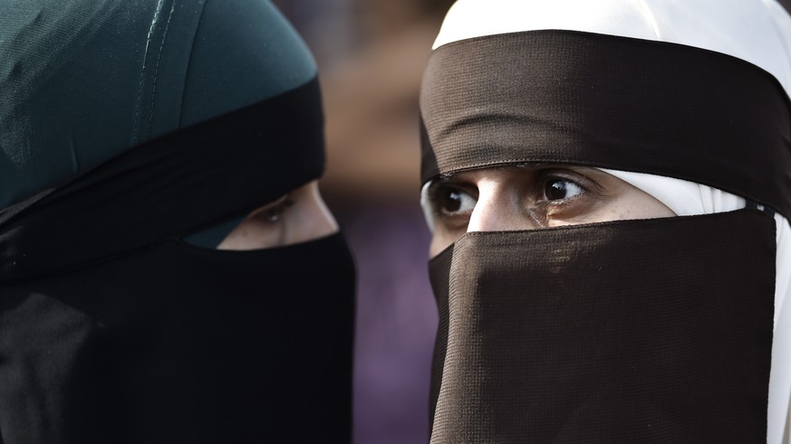 epa06922108 Face covered women protest in Copenhagen, Denmark, 01 August 2018, on the first day of the implementation of the Danish face veil ban. Under the new law, all apparel covering the face is f ...