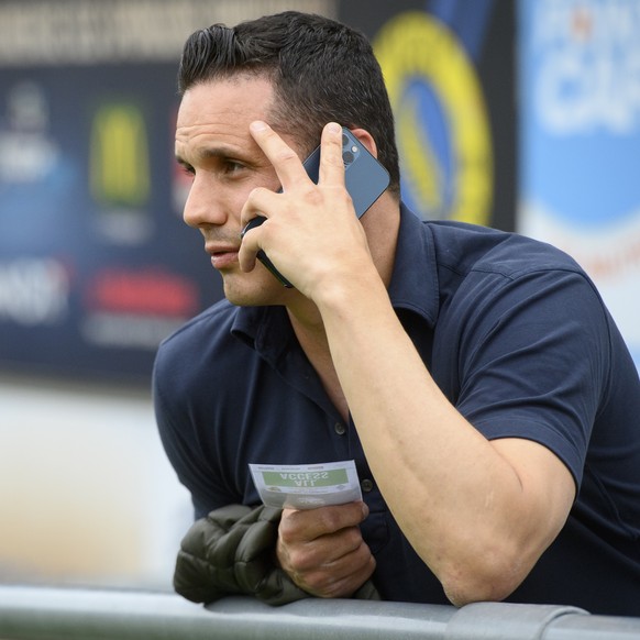Basel&#039;s director of the board David Degen speaks on his mobile phone during a friendly soccer match as part of the Festival de Football des Alpes between FC Basel 1893 of Switzerland and FC Dynam ...