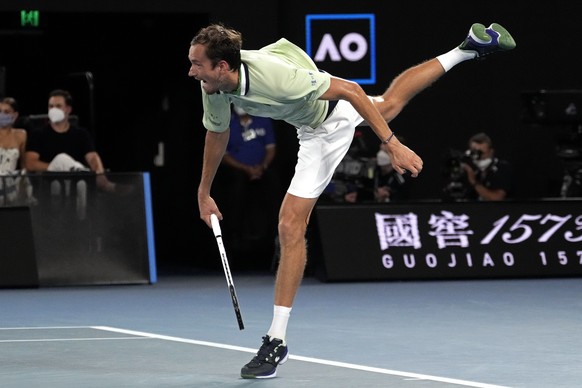 Daniil Medvedev of Russia serves to Stefanos Tsitsipas of Greece during their semifinal match at the Australian Open tennis championships in Melbourne, Australia, Friday, Jan. 28, 2022. (AP Photo/Simo ...