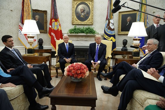 In this Sept. 6, 2017, photo, President Donald Trump pauses during a meeting with Congressional leaders in the Oval Office of the White House, Wednesday, Sept. 6, 2017, in Washington. From left, Speak ...