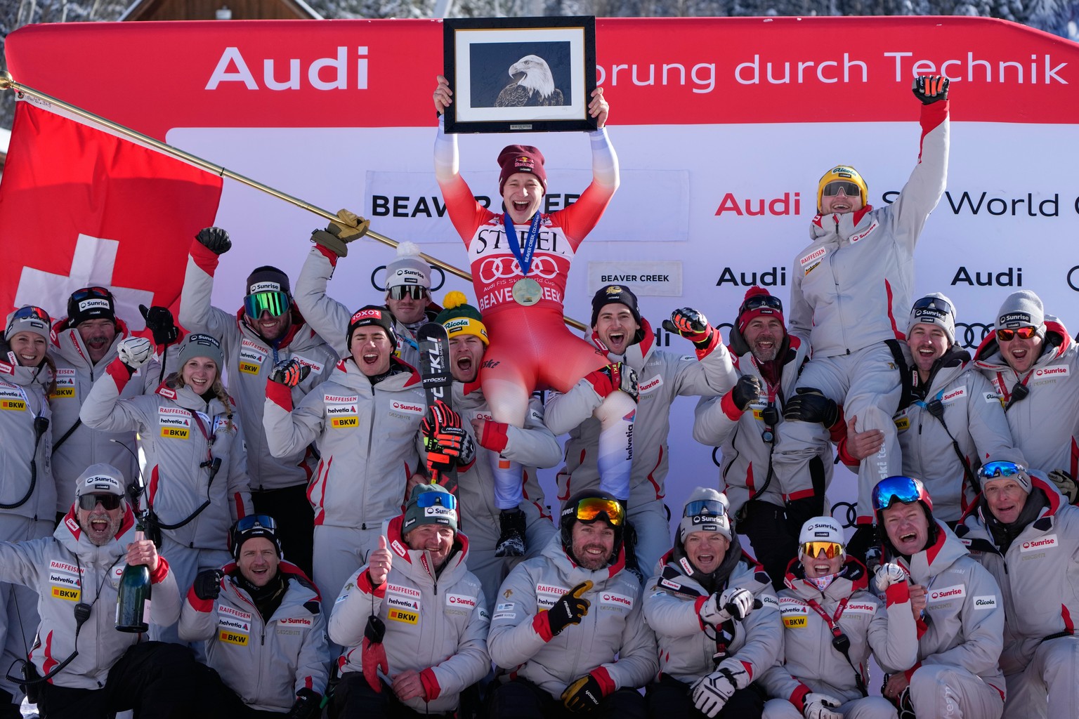 First place finisher Switzerland&#039;s Marco Odermatt celebrates with team members after a World Cup men&#039;s downhill skiing race, Thursday, Dec. 4, 2025, in Beaver Creek, Colo. (AP Photo/John Loc ...