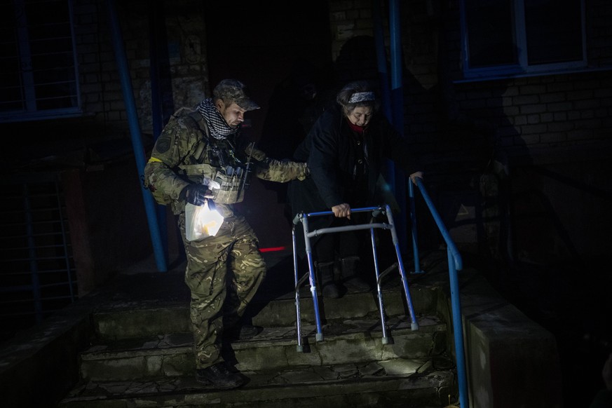Elderly residents are evacuated from the southern city of Kherson, Ukraine, Sunday, Nov. 27, 2022. Shelling by Russian forces struck several areas in eastern and southern Ukraine overnight as utility  ...