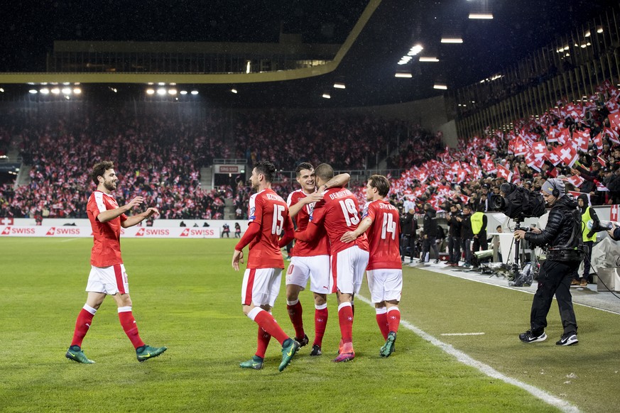 Swiss soccer players celebrates after scoring a goal with Swiss forward Eren Derdiyok, 2nd right, during the 2018 Fifa World Cup group B qualification soccer match between Switzerland and Faroe Island ...