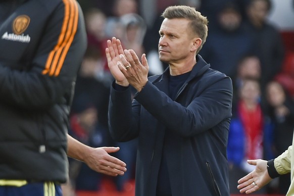 Leeds United's head coach Jesse Marsch applauds after losing 0-1 against Nottingham Forest in an English Premier League soccer match at City Ground stadium in Nottingham, England, Feb. 5, 2023. Americ ...