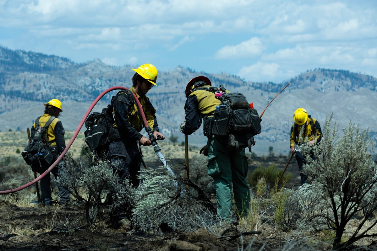 August 13, 2026, Paris, California, USA: Wildland firefighters mop up a section of the Bug Fire after it crossed the border of Nevada near Reno. The fire jumped Highway 395 the night before. Paris USA ...