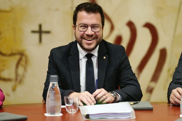 epa11338619 Acting Catalan regional President, Pere Aragones (C), of ERC party, smiles as he chairs the weekly Catalan regional cabinet meeting in Barcelona, Spain, 14 May 2024. The meeting is held a  ...