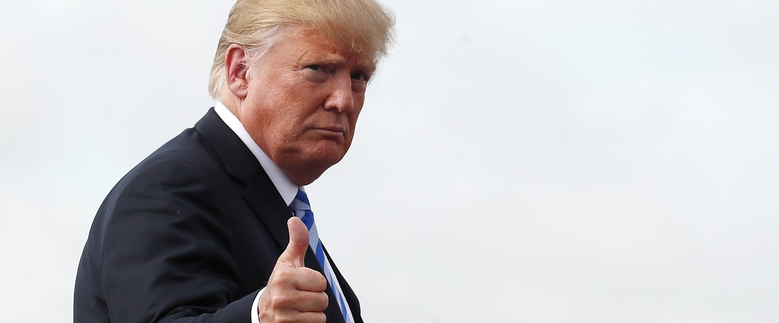 President Donald Trump boards Air Force One at Andrews Air Force Base, Md., Tuesday, Aug. 21, 2018, to travel to Charleston, WVa., for a rally. (AP Photo/Alex Brandon)