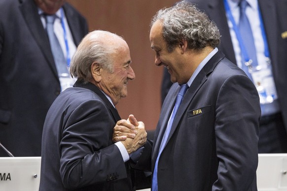 epa09559443 (FILE) - FIFA president Joseph S. Blatter (L) shakes hands with UEFA president Michel Platini (R) after his election as president at the Hallenstadion in Zurich, Switzerland, 29 May 2015 ( ...