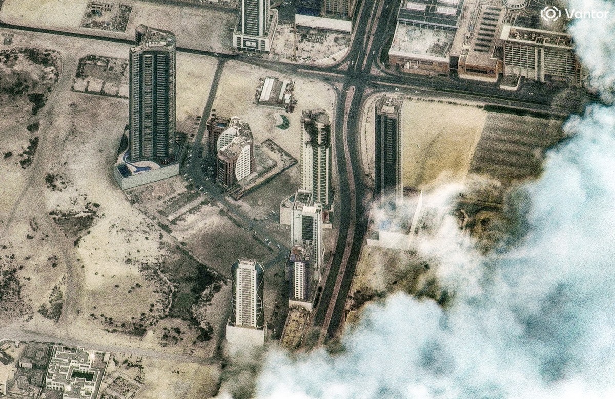 epa12795037 A handout satellite image made available by Vantor shows drone attack damage on The Breaker high-rise apartment building, in Manama, Bahrain, 02 March 2026 (issued 04 March 2026). A joint  ...