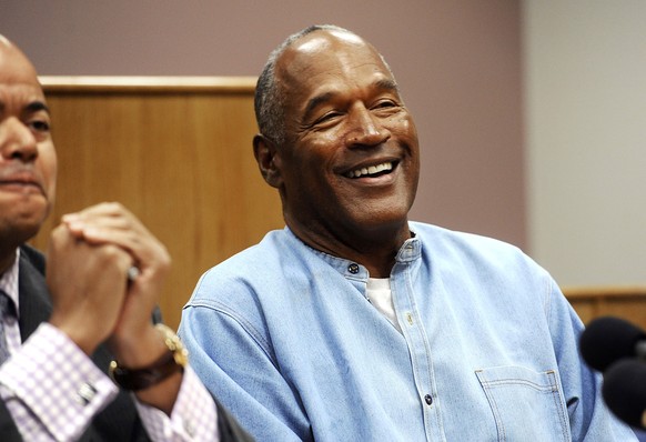 FILE - In this July 20, 2017, file photo, former NFL football star O.J. Simpson reacts after learning he was granted parole at Lovelock Correctional Center in Lovelock, Nev. Simpson got into a series  ...