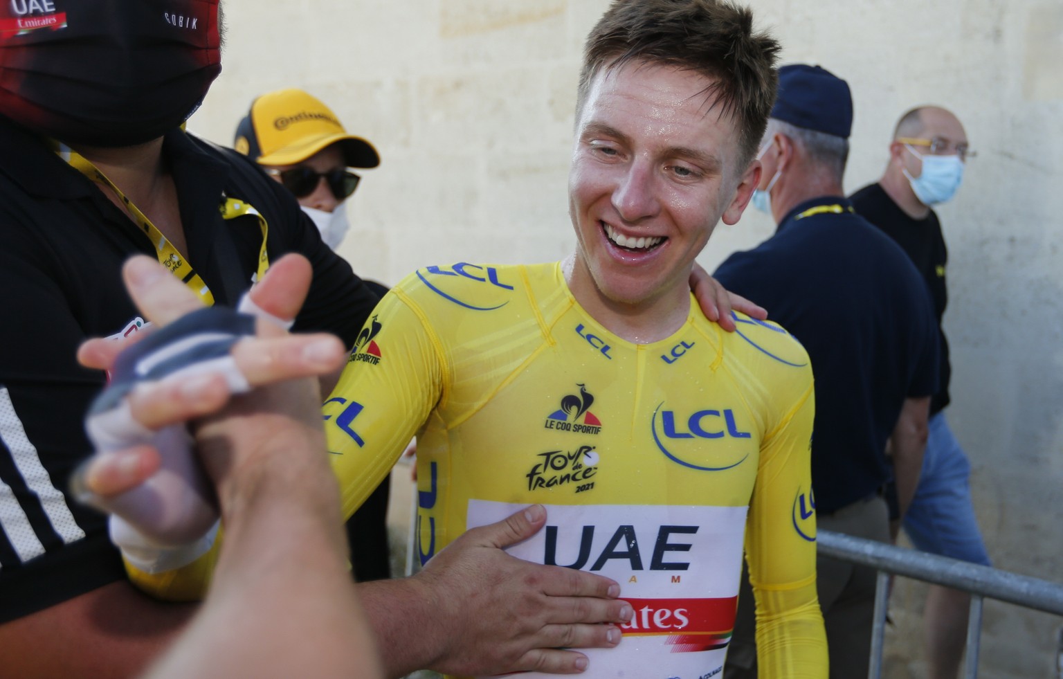 Slovenia&#039;s Tadej Pogacar, wearing the overall leader&#039;s yellow jersey, celebrates after the twentieth stage of the Tour de France cycling race, an individual time-trial over 30.8 kilometers ( ...