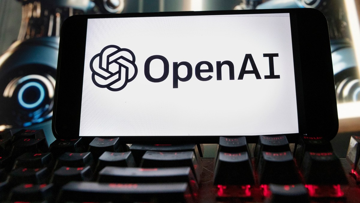 FILE - The OpenAI logo is displayed on a cellphone with an image on a computer monitor generated by ChatGPT's Dall-E text-to-image model, Dec. 8, 2023, in Boston. (AP Photo/Michael Dwyer, File)
A ...