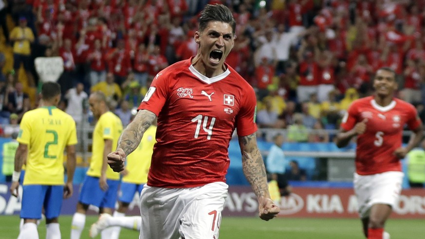 Switzerland's Steven Zuber celebrates after scoring his side's opening goal during the group E match between Brazil and Switzerland at the 2018 soccer World Cup in the Rostov Arena in Rostov ...