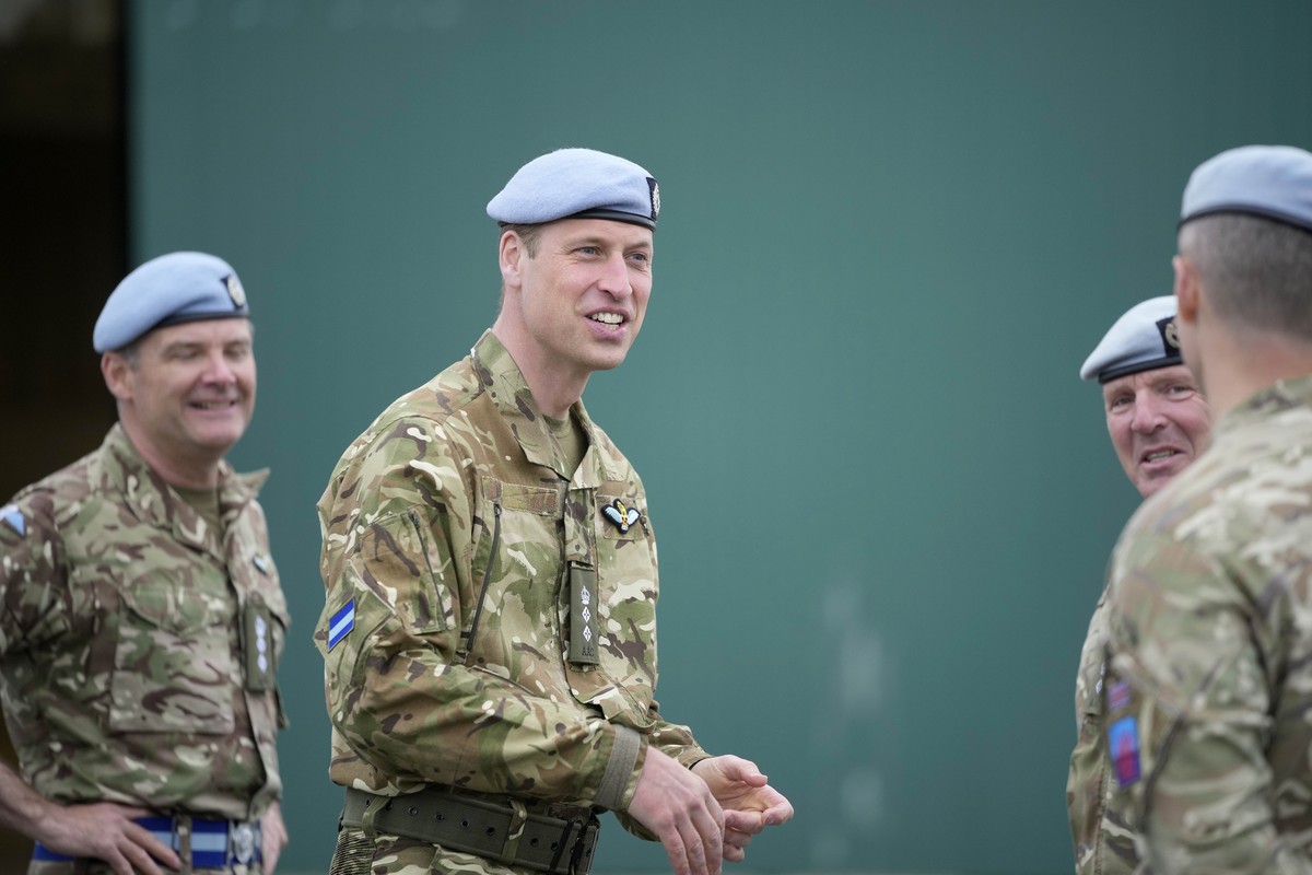 Britain's Prince William speaks to service personal at the Army Aviation Centre in Middle Wallop, England, Monday, May 13, 2024. King Charles III officially handed over the role of Colonel-in-Chi ...