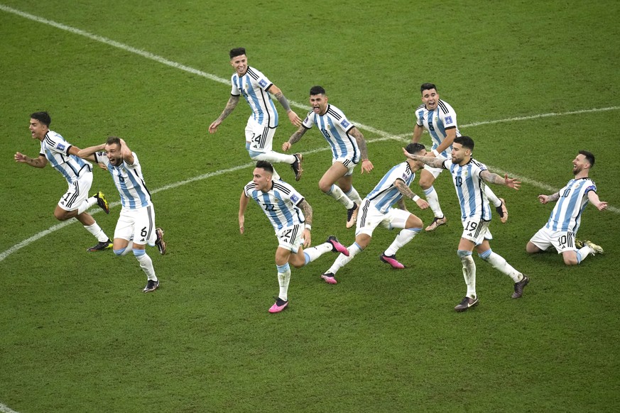 Argentina&#039;s players celebrate their victory at the end of the World Cup final soccer match between Argentina and France at the Lusail Stadium in Lusail, Qatar, Sunday, Dec. 18, 2022. (AP Photo/Ch ...