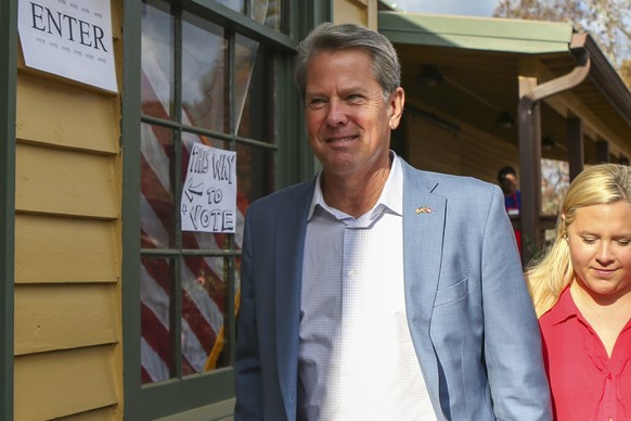Republican candidate for Georgia Governor Gov. Brian Kemp arrives to vote Tuesday, Nov. 8, 2022 in Winterville, Ga. (AP Photo/Brett Davis)