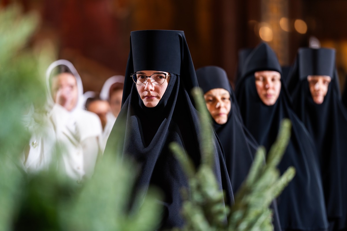 epa11810769 A handout photo made available by the press service of the Patriarch of Moscow and all Russia, shows nuns attending a Christmas Eve service at the Cathedral of Christ the Savior in Moscow, ...