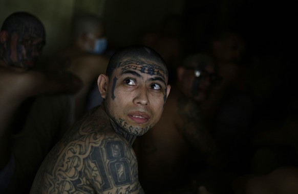 epa08388097 Members of Barrio 18 gang remain in a cell at the Penitentiary Complex in Izalco, El Salvador, 27 April 2020. Salvadorean President Nayib Bukele ordered jails to impose solitary confinemen ...