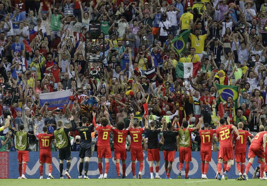 Belgium players salute fans after defeating Brazil in their quarterfinal match at the 2018 soccer World Cup in the Kazan Arena, in Kazan, Russia, Friday, July 6, 2018. (AP Photo/Andre Penner)