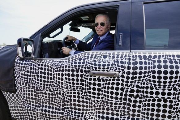 President Joe Biden stops to talk to the media as he drives a Ford F-150 Lightning truck at Ford Dearborn Development Center, Tuesday, May 18, 2021, in Dearborn, Mich. (AP Photo/Evan Vucci)
Joe Biden