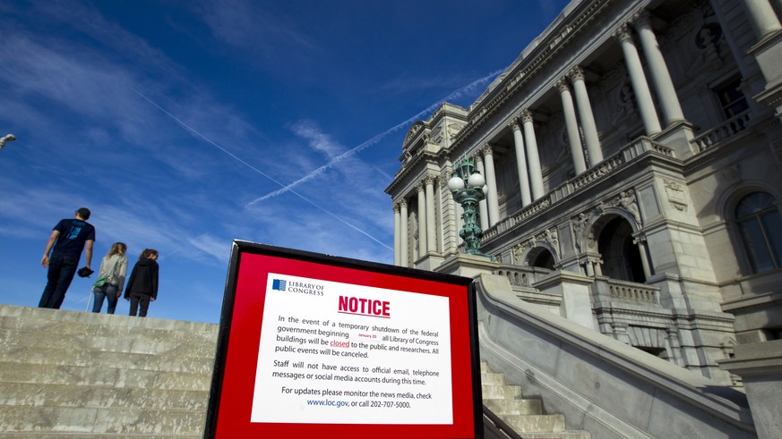 Library of Congress post a sign letting people know is closed due the shut down of the government on Saturday, Jan. 20, 2018, at the Capitol in Washington. The federal government shut down at the stro ...