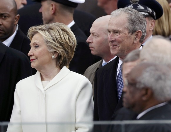 Former Democratic presidential candidate Hillary Clinton (L) and former president George W. Bush look on at inauguration ceremonies swearing in Donald Trump as the 45th president of the United States  ...