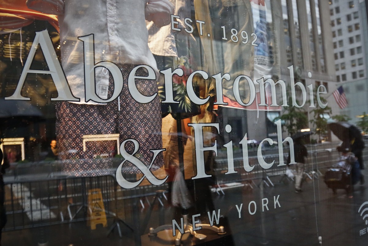 FILE - In this May 22, 2017, file photo, a store window reflects a street scene at an Abercrombie &amp; Fitch store on New York's Fifth Avenue. A former model for Abercrombie &amp; Fitch has sued ...