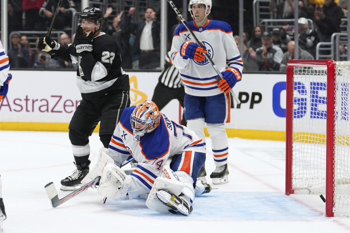 Edmonton Oilers goaltender Stuart Skinner, center, is scored on by Los Angeles Kings center Phillip Danault as left wing Kevin Fiala, left, celebrates during the second period in Game 1 of an NHL hock ...