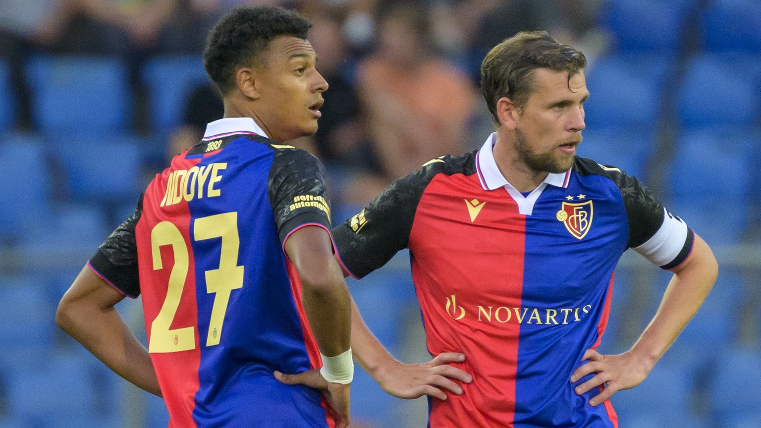Basel&#039;s Dan Ndoye, left, and Fabian Frei, rigtht, wait for the kickoff after they concede the third goal during the UEFA Conference League second qualifying round first leg match between Switzerl ...