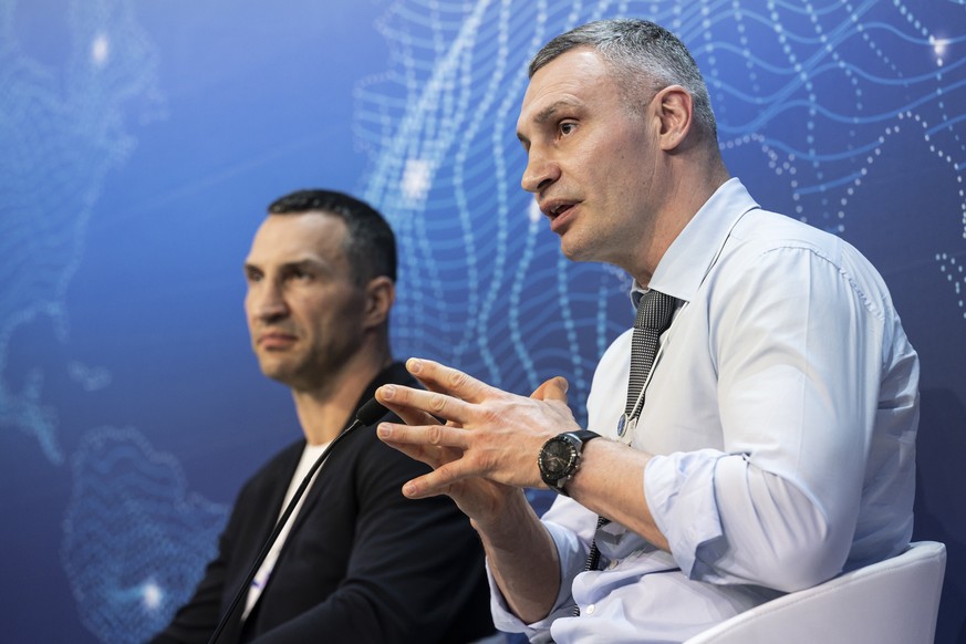 Wladimir Klitschko, Ukrainian former professional boxer and businessman, left, and his brother Vitali Klitschko, Mayor of Kyiv and also former professional boxer, addresses a panel session during the  ...