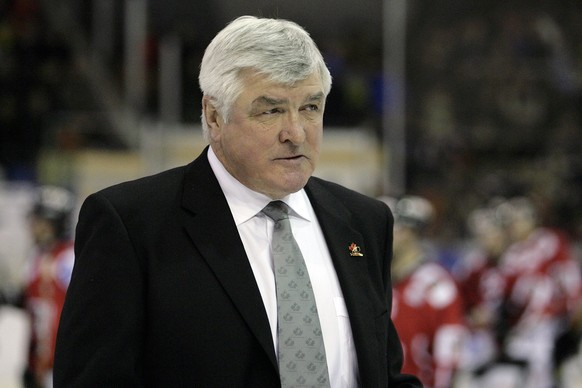 Team Canada's head coach Pat Quinn leaves the ring after the game between Team Canada and Germany's EHC Eisbaeren Berlin at the 80th Spengler Cup ice hockey tournament, in Davos, Switzerland ...