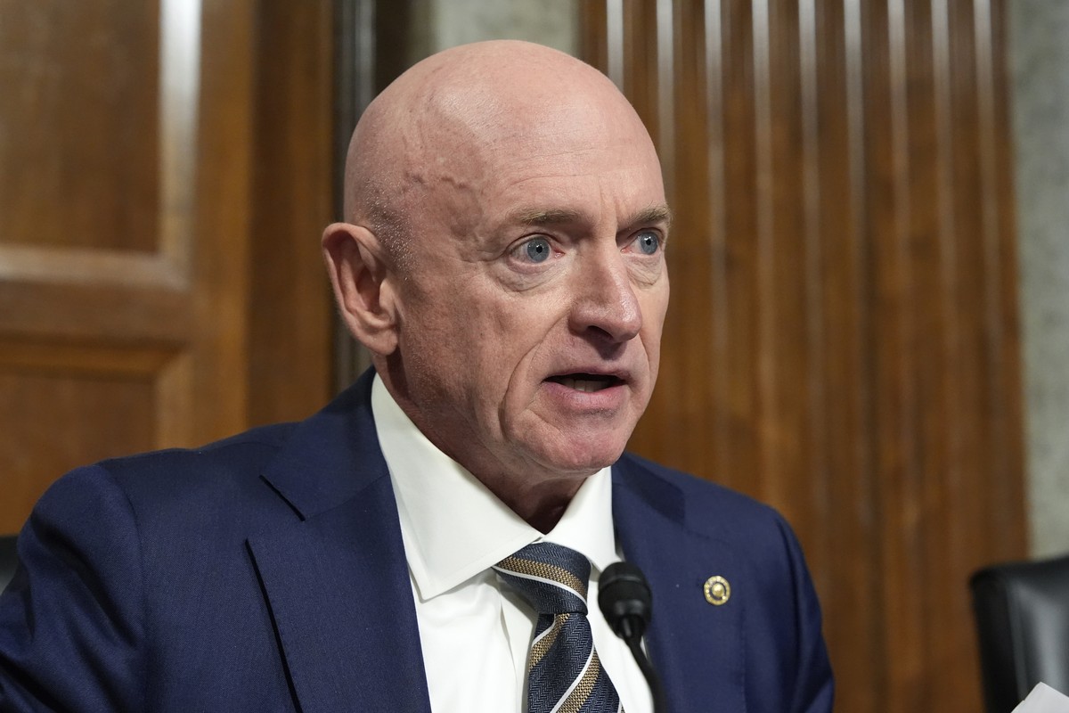 Sen. Mark Kelly, D-Ariz. speaks at the Senate Armed Services Committee for his confirmation hearing of Pete Hegseth, President-elect Donald Trump's choice to be Defense secretary, at the Capitol  ...