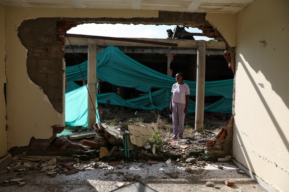 Eucaris Zamora stands in front of her home destroyed during an attack involving drones by a dissident branch of the former Revolutionary Armed Forces of Colombia, or FARC, guerrilla group in Robles, C ...