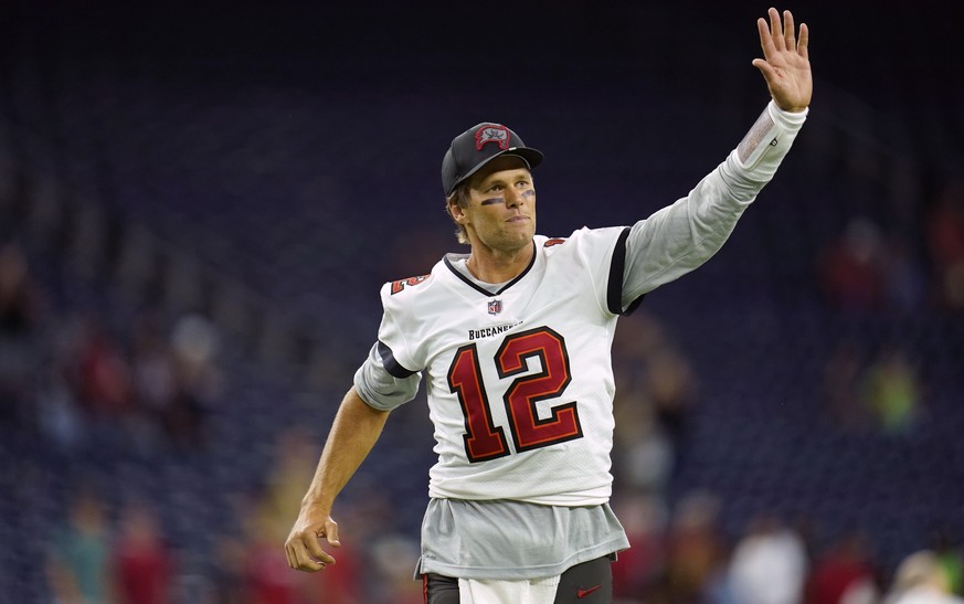 FILE - Tampa Bay Buccaneers quarterback Tom Brady (12) waves toward the fans as he leaves the field after an NFL preseason football game against the Houston Texans, Saturday, Aug. 28, 2021, in Houston ...