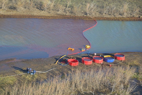 epa08474705 A handout picture made available by the press service of the Public Joint Stock Company &#039;Transneft&#039; shows an aerial view of rescue works the site of oil products spill into the A ...