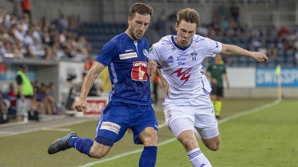 Otar Kakabadze, left, from FC Luzern and Patrik Johannesen, right, from KI Klaksvik at the Europa League Qualification game, round 2 match between Switzerlands`s FC Luzern and Faroe Islands Team of KI ...