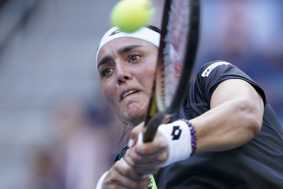 Ons Jabeur, of Tunisia, returns a shot to Qinwen Zheng, of China, during the fourth round of the U.S. Open tennis championships, Monday, Sept. 4, 2023, in New York. (AP Photo/Eduardo Munoz Alvarez)