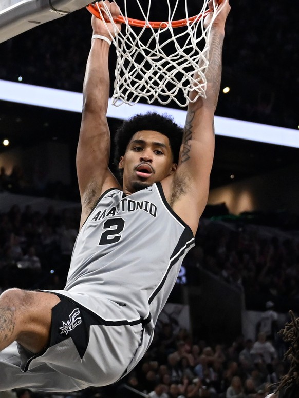 San Antonio Spurs guard Dylan Harper (2) dunks during the second half of an NBA basketball game against the Portland Trail Blazers, Wednesday, April 8, 2026, in San Antonio. (AP Photo/Darren Abate)
Dy ...