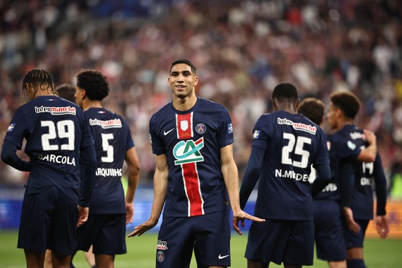 epa12132542 Acharaf Hakimi of Paris Saint Germain (C) celebrates after soring a goal during the Coupe de France final soccer match between Paris Saint Germain (PSG) and Reims in Saint-Denis, near Pari ...