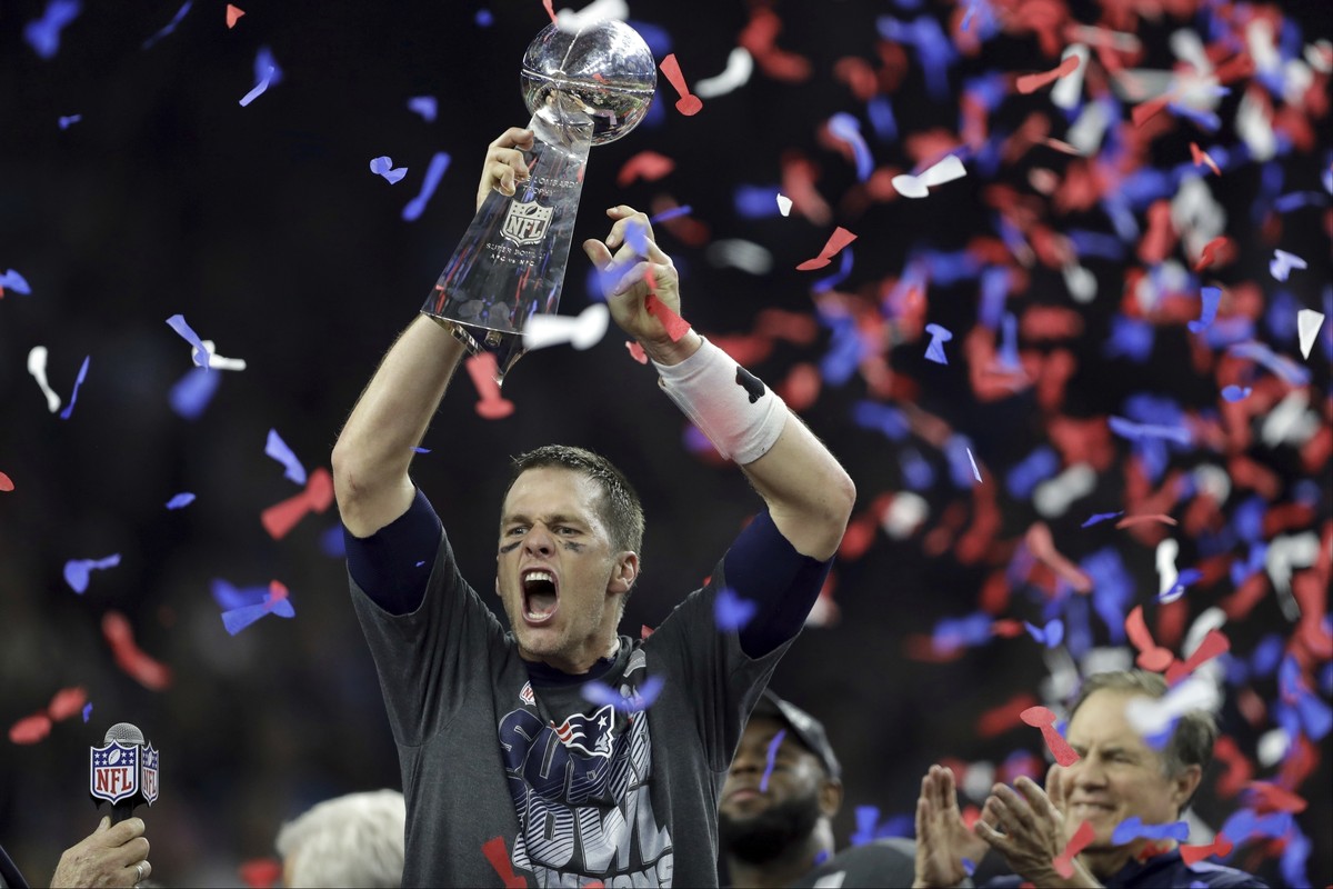 FILE - In this Feb. 5, 2017, file photo, New England Patriots' Tom Brady raises the Vince Lombardi Trophy after defeating the Atlanta Falcons in overtime at the NFL Super Bowl 51 football game in ...