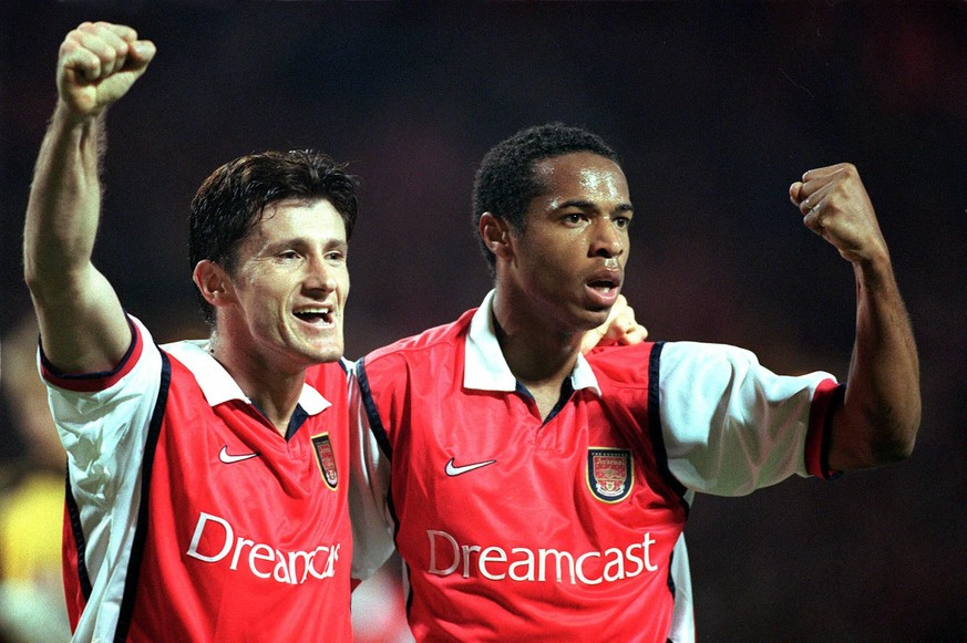 Davor Suker celebrates his goal (Arsenals 3rd) with Thierry Henry (scorer of the 2nd goal). Arsenal 3:1 AIK Solna, UEFA Champions League, Wembley Stadium, 22/9/99. PUBLICATIONxNOTxINxUKxBRA

before  ...