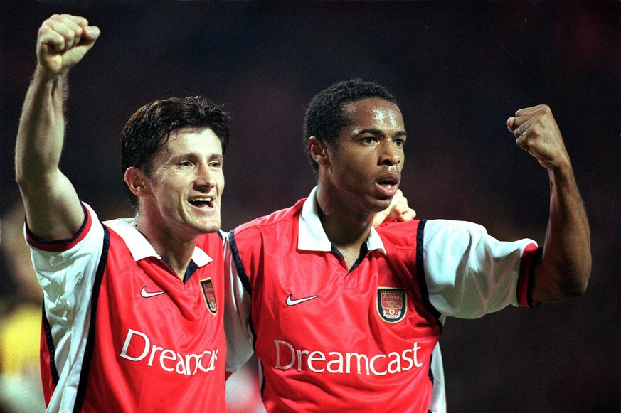 Davor Suker celebrates his goal (Arsenals 3rd) with Thierry Henry (scorer of the 2nd goal). Arsenal 3:1 AIK Solna, UEFA Champions League, Wembley Stadium, 22/9/99. PUBLICATIONxNOTxINxUKxBRA

before  ...