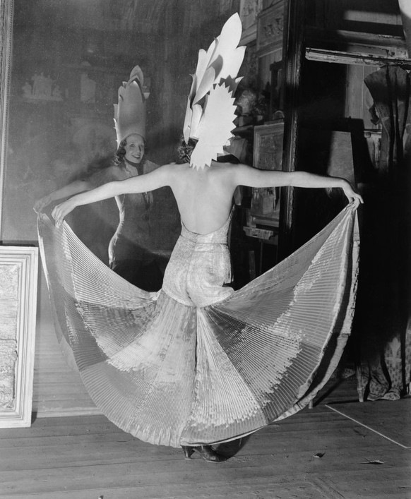 A female art student in her costume in front of a mirror before the Chelsea Arts Ball, London, 27 October 1931. Photograph by George Woodbine. (Photo by Daily Herald Archive/National Science &amp; Med ...