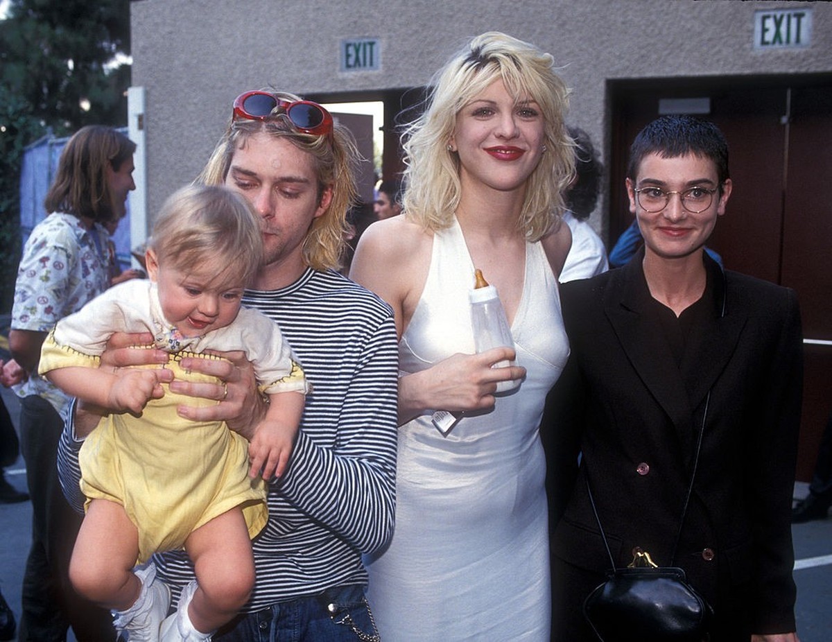 Kurt Cobain of Nirvana with wife Courtney Love and daughter Frances Bean Cobain, and Sinead O'Connor (Photo by Ke.Mazur/WireImage)